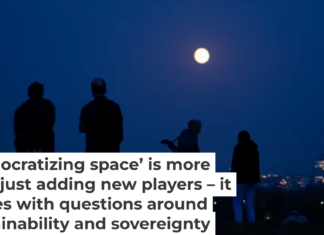 A group of people gaze up at the Moon in Germany. AP Photo/Markus Schreiber